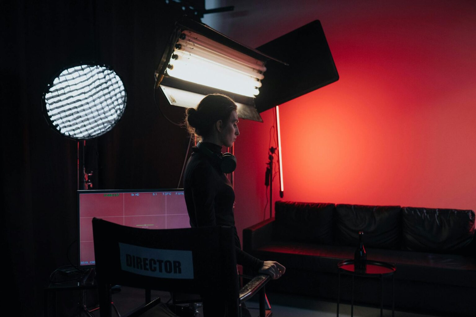 Professional television studio with bright overhead lighting and production equipment