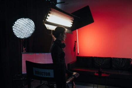 Professional television studio with bright overhead lighting and production equipment