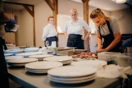 Why Wealthy Families Are Hiring Professional Queue-Waiters for Popular Restaurants People waiting in line outside a busy restaurant during peak dining hours