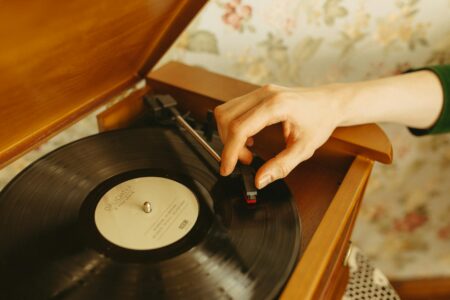 Vintage record player with vinyl album spinning on turntable