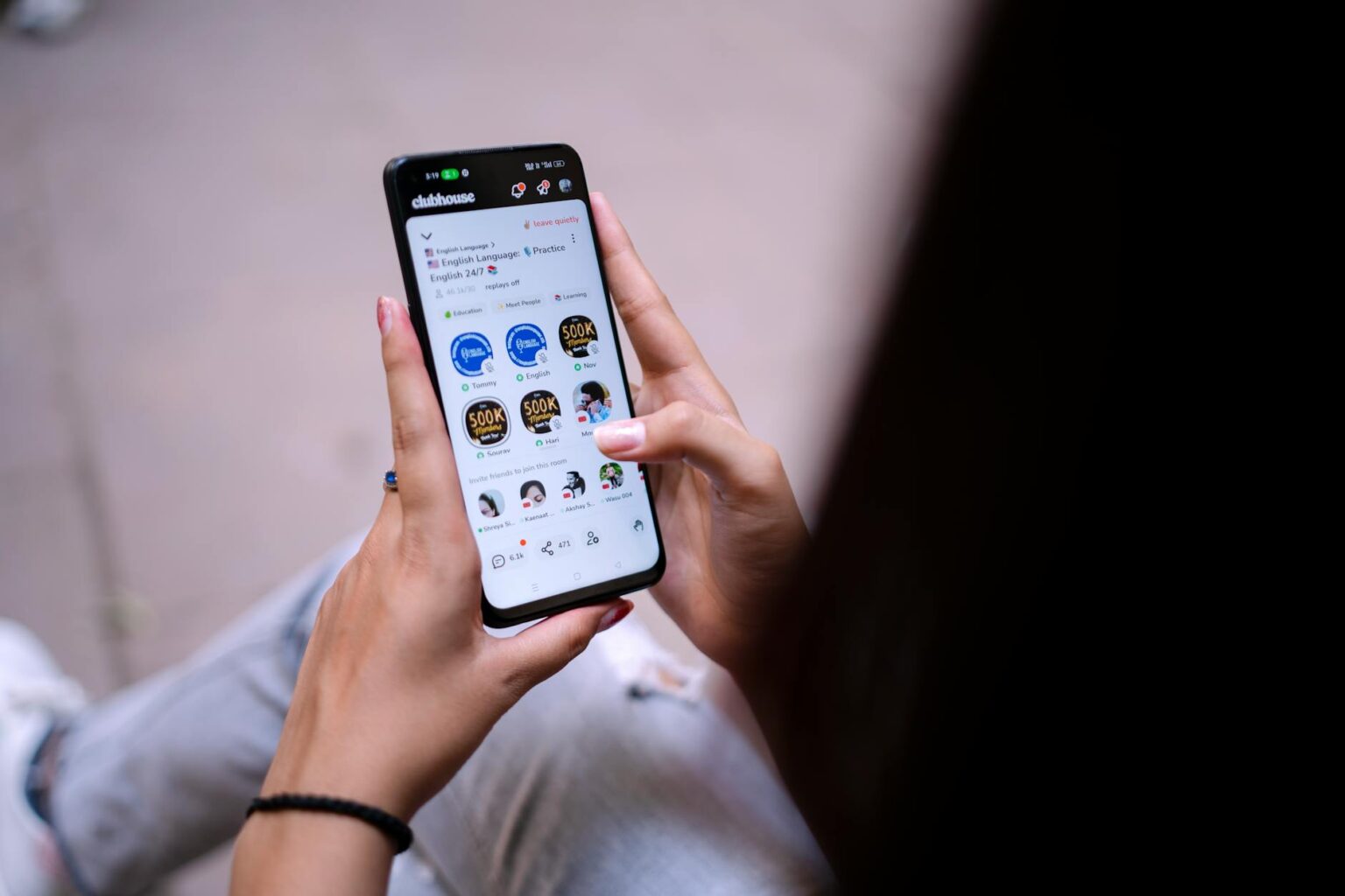 Person holding smartphone displaying social media interface with wellness content