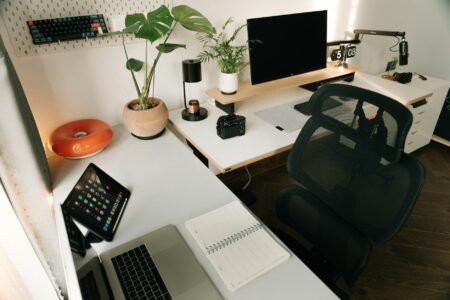 Modern home office setup with adjustable desk and organized workspace