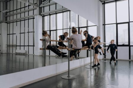 How K-Pop Choreography Classes Are Replacing Traditional Dance Studios Modern dance studio with mirrors and wooden floors where K-pop choreography classes take place
