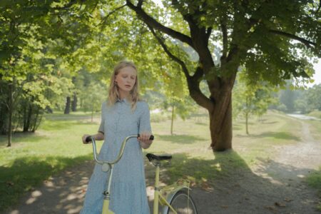 Ice Blue Dominates Summer 2026 Fashion Searches Woman wearing a light blue summer dress