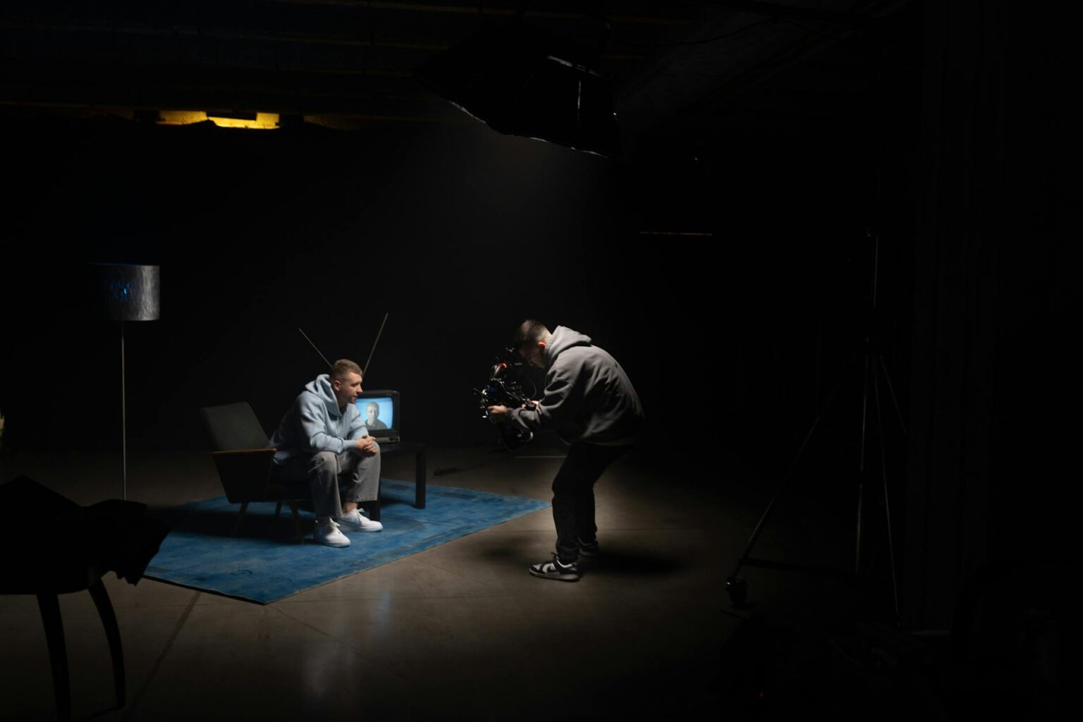 Television studio with cameras and lighting equipment during production