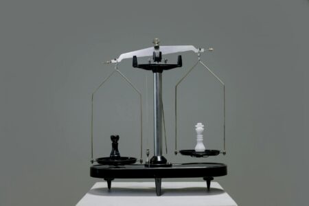 Vintage brass scales balanced on wooden surface representing Libra's quest for equilibrium