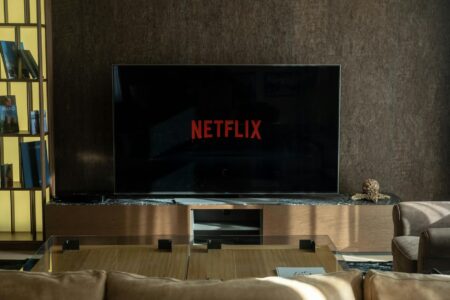 Person watching streaming content on television in living room