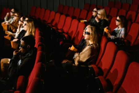 Is The Sheep Detectives Worth Watching? People sitting in movie theater seats watching a film