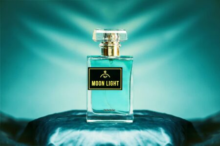 The Best Fragrances To Gift Your Mom For Mother’s Day Elegant perfume bottles arranged on a marble surface with soft lighting