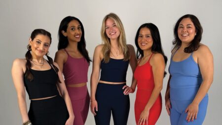 Fashion editors examining athletic wear pieces for quality and fit testing