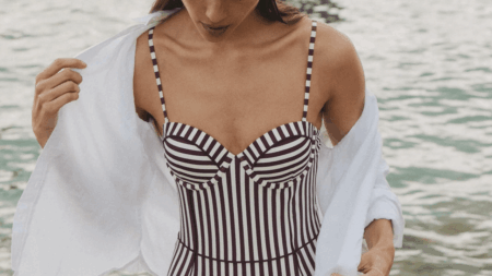 Why One-Piece Swimwear Dominates Summer 2024 Shopping Lists Woman in one-piece swimsuit by swimming pool