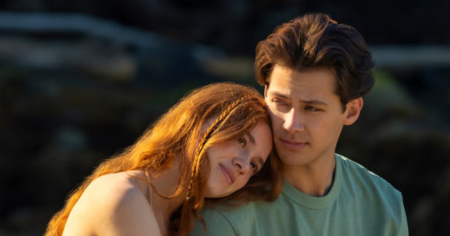 Everything We Know About Every Year After A wooden dock extending into a calm lake on a sunny summer day