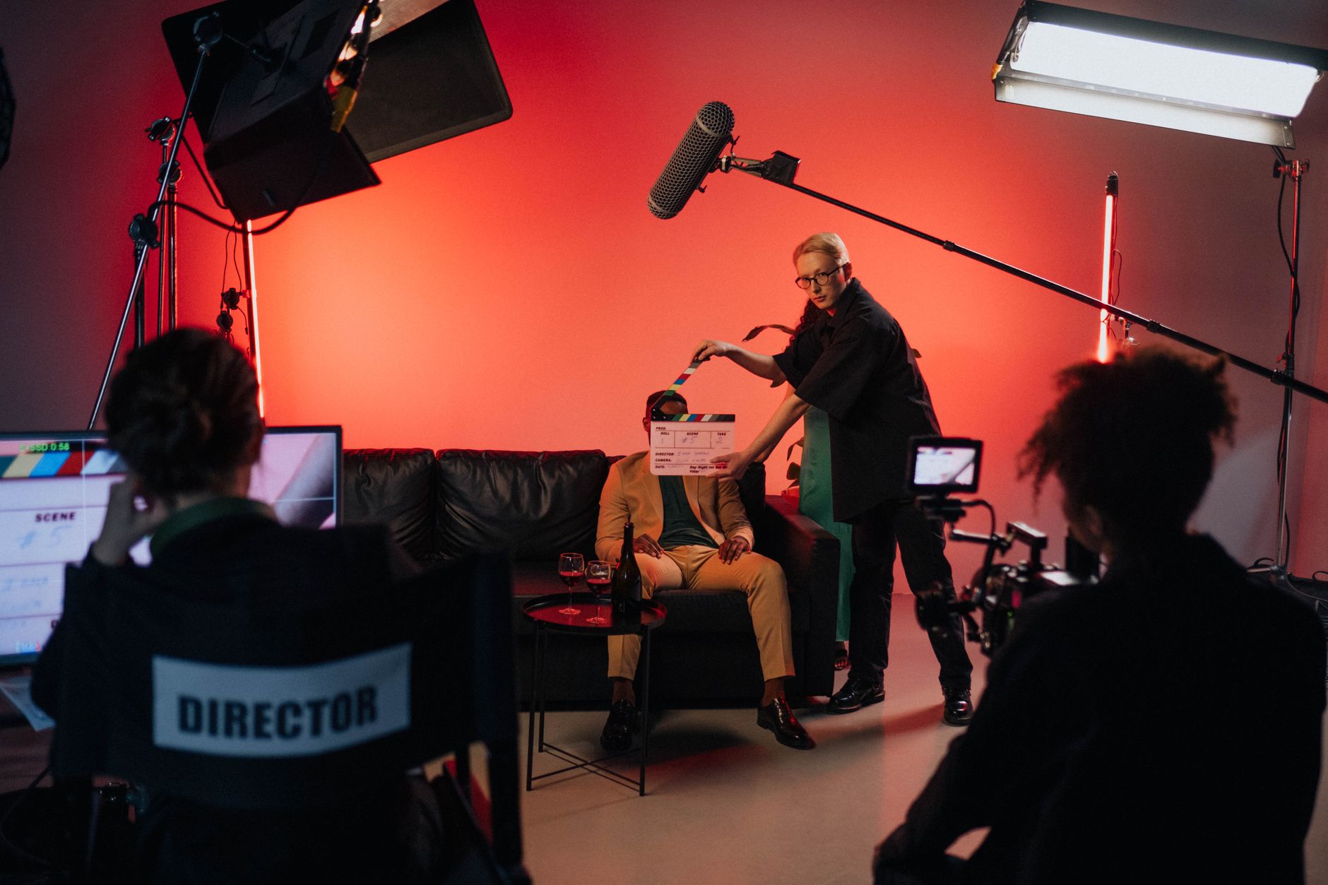 Behind-the-scenes view of a film production set with crew and equipment