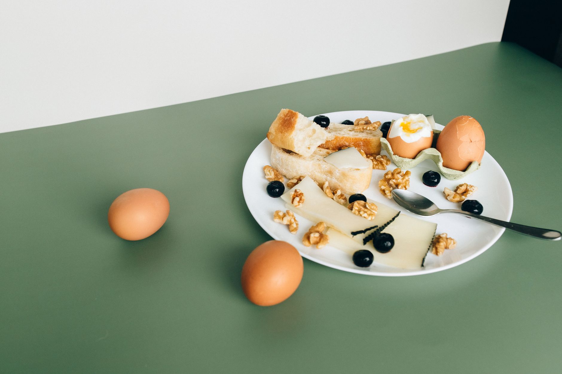 Simple breakfast plate with eggs, Greek yogurt, and fresh fruit