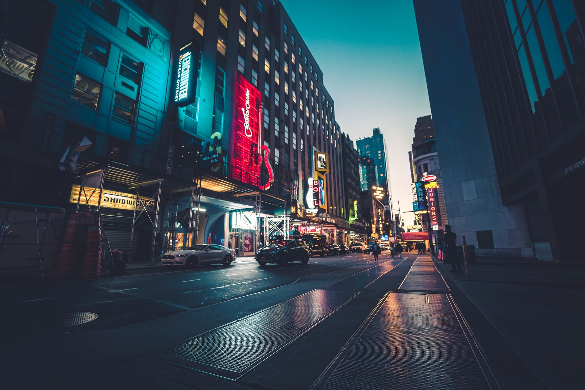 New York City streets at night with blurred lights and urban atmosphere