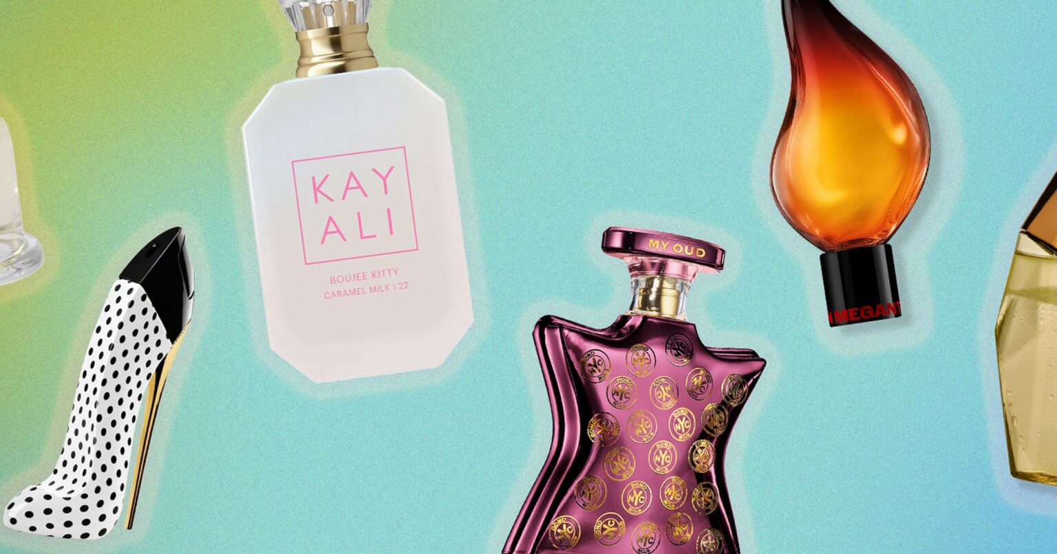 Several glass perfume bottles arranged on a sunny surface with warm light