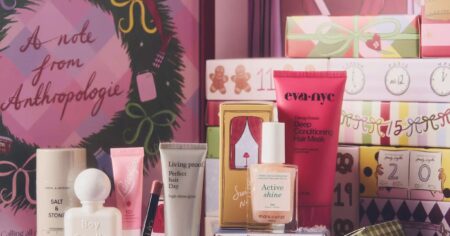 Assorted beauty products arranged inside an advent calendar box