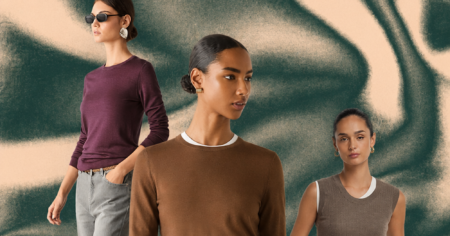 Neatly folded cashmere sweaters in neutral tones stacked on a shelf