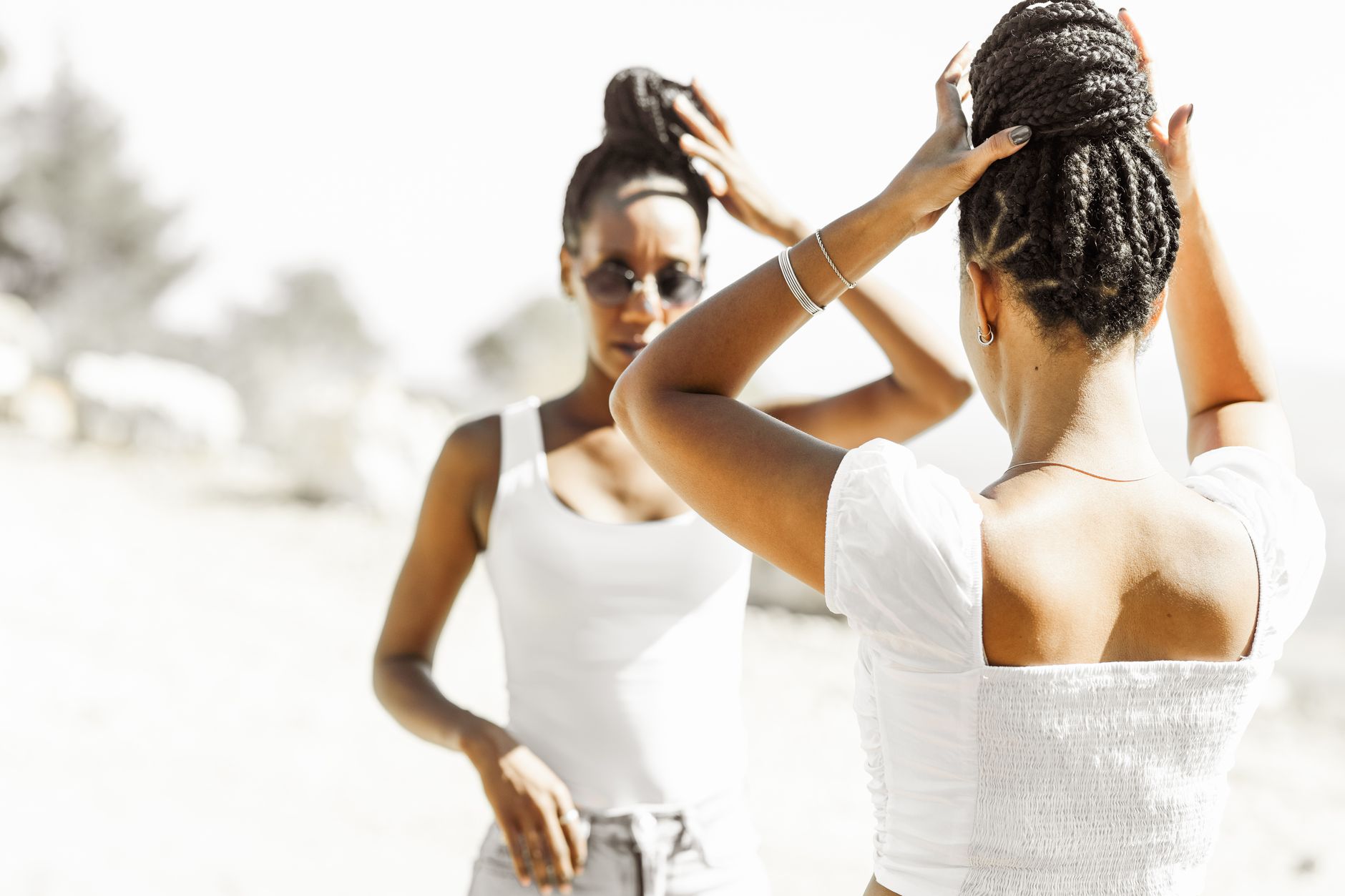 Close-up of natural Black hair being styled with care