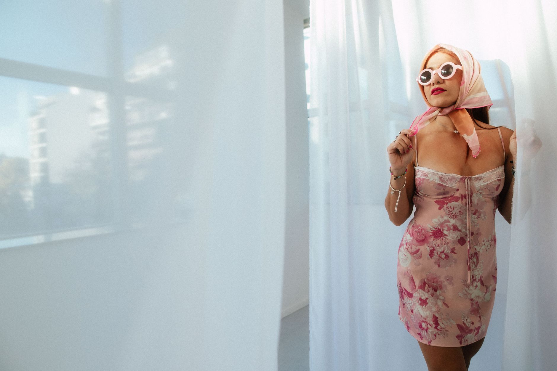 A model in a printed slip dress evoking late 1990s fashion aesthetics