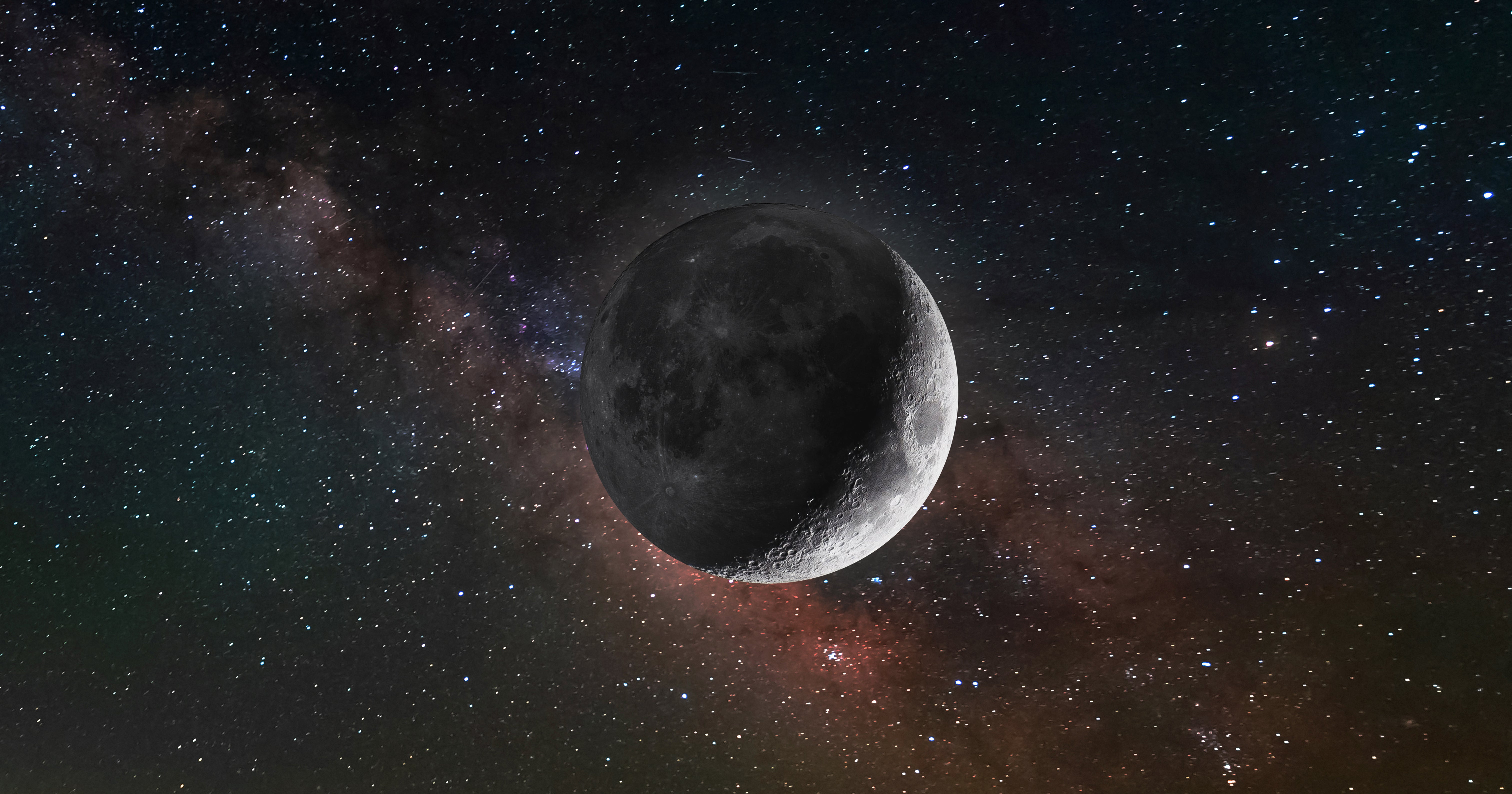 Full moon photographed against a dark blue night sky with visible stars