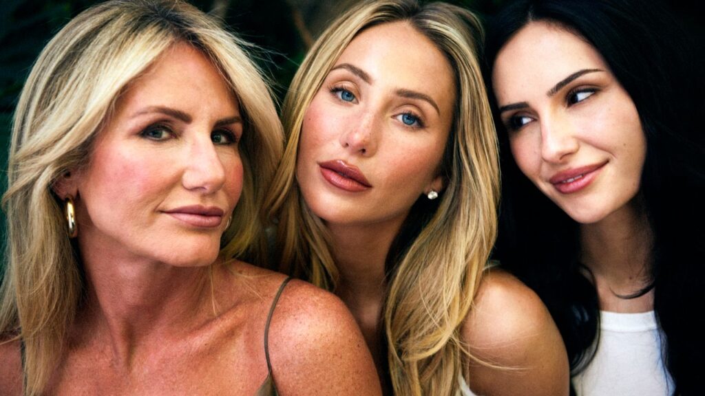 Alix Earle Opens Up About Her Family’s BRCA2 Mutation Two young women sitting outdoors having a serious conversation