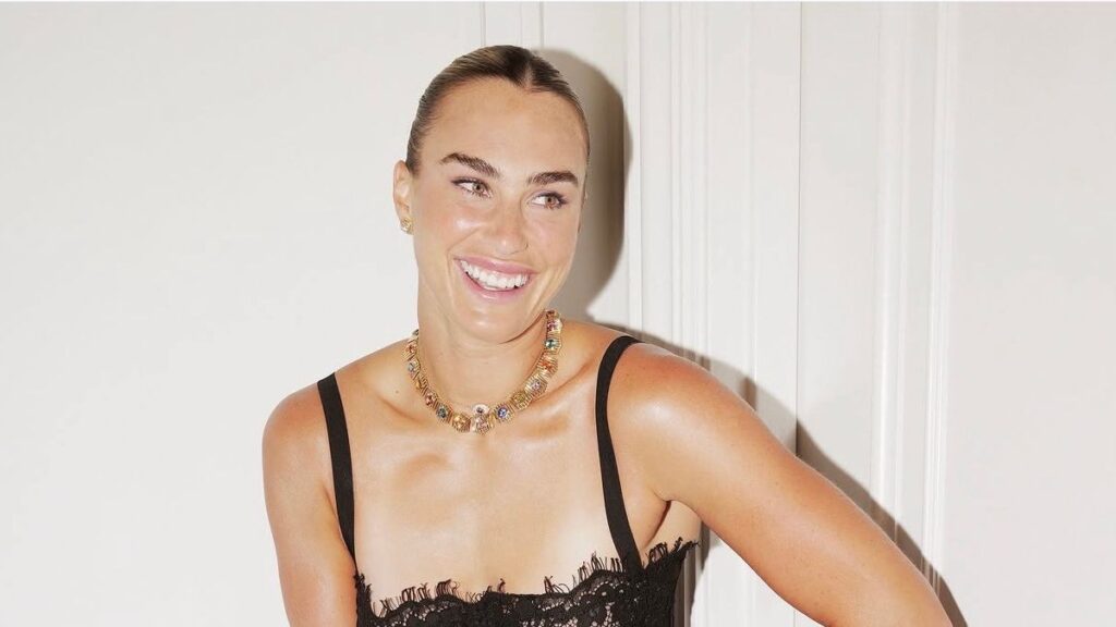 Aryna Sabalenka Dresses Like She Plays: On Her Own Terms Woman wearing large statement jewelry and a confident off-duty outfit