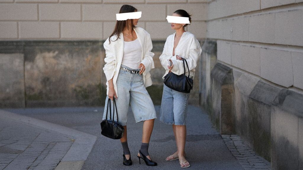 What to Do When Your Friend Notices You Copied Their Style Two women browsing clothing racks together in a boutique